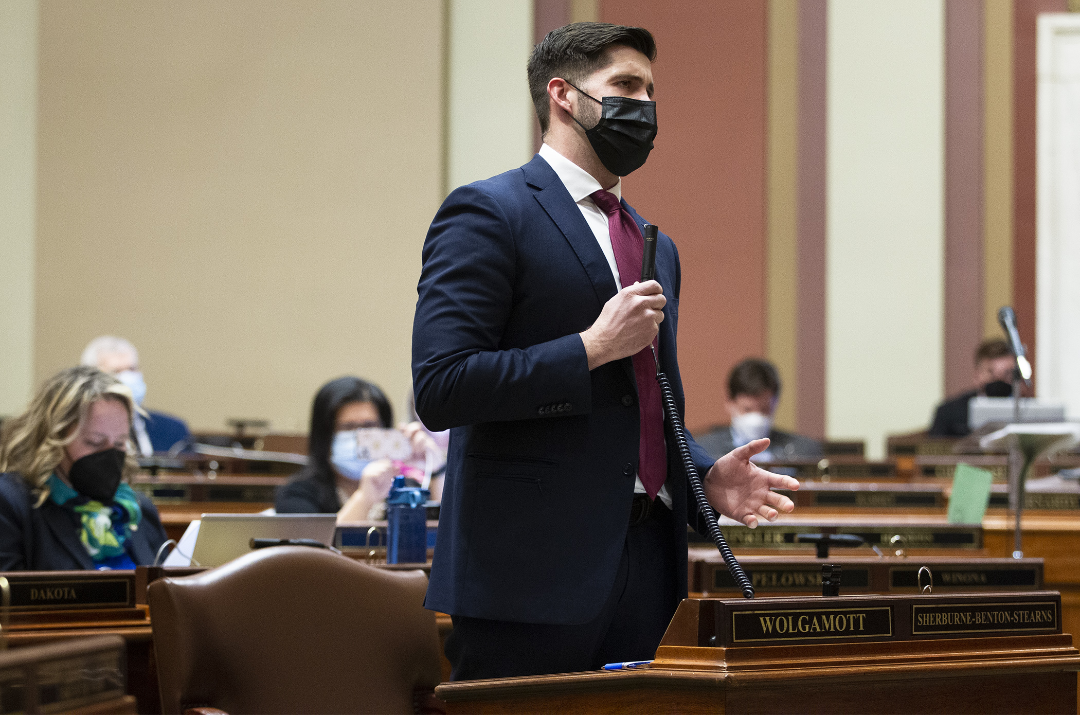 Rep. Dan Wolgamott discusses the first bill to be debated on the House Floor in 2022. HF1203 would, in part, maintain COVID-19 workers’ compensation coverage for eligible frontline workers until May 31, 2023. (Photo by Paul Battaglia)